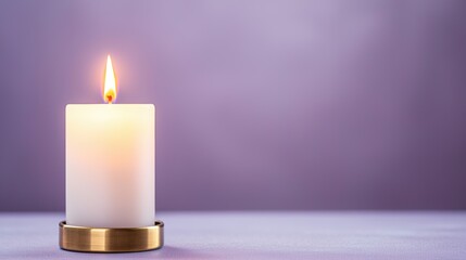 Poster - A lit white candle in a gold holder sits on a soft surface against a softly blurred purple background.