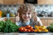 © ChaoticMind - Happy child showing thumbs up while surrounded by fresh vegetables in a kitchen setting
