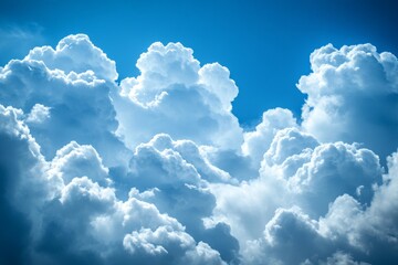 Poster - Beautiful fluffy clouds in a bright blue sky create stunning patterns and textures above during midday hours