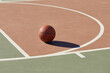 © Tetra Images - Basketball on outdoor basketball court