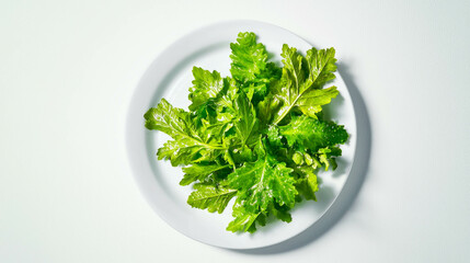 Poster - Fresh melissa leaves on white plate for natural culinary themes