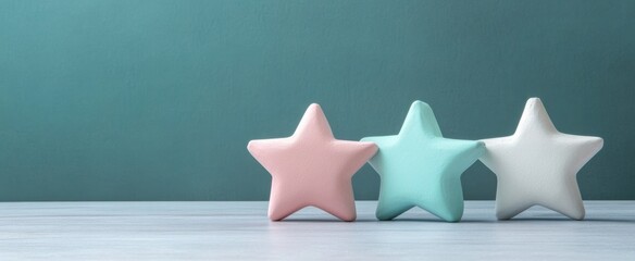 Poster - This image features three decorative pastel stars in soothing colors, arranged on a wooden surface. Ideal for evoking calmness and creativity in design projects.