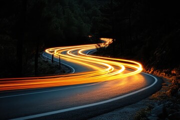 Poster - Dynamic light trails illuminate a winding asphalt road through a dark forest at night creating a sense of speed and adventure with a long exposure