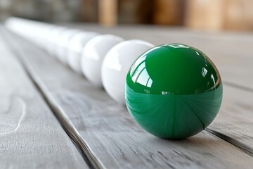 Poster - Unique arrangement of glossy green and white balls on a rustic wooden surface in a well-lit interior space