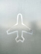© ADDICTIVE STOCK - Airplane Symbol on Glass at Airport