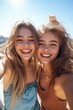 © Georgii - Two young women smiling and taking a selfie on a sunny day