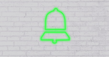 Poster - Neon green bell icon glowing against white brick wall background