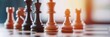 © SerPak - Close-up of wooden chess pieces on board with sunlight.
