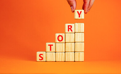 Fototapete - Story symbol. Concept word Story on beautiful wooden blocks. Beautiful orange table orange background. Businessman hand. Business lifestyle story concept. Copy space.