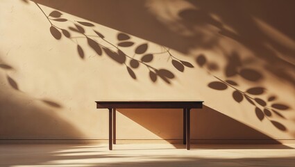 Poster - Shadows of leaves cast on a beige wall beside a wooden table in a serene indoor space during daylight hours