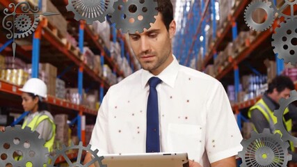 Poster - In warehouse, worker using tablet with animation of gears overlaying scene