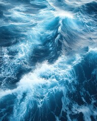 Poster - Aerial view of deep blue ocean waves crashing and foaming creating a dynamic seascape with a sense of vastness and power