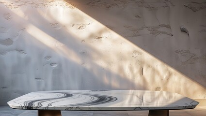 Poster - Elegant monochrome marble table casting shadows in a minimalist space during golden hour