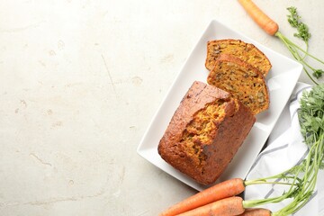 Wall Mural - homemade carrot cake with nuts and vegetables on light grey table, flat lay. space for text