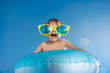 © Sunny studio - Happy child playing in waterpark. Kid having fun on summer vacation