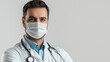 © ALSADRA - Male doctor wearing a medical mask and lab coat against a neutral background