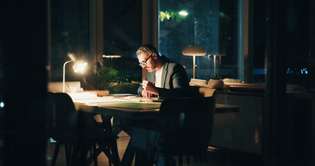 Poster - Architecture, night and mature man in office for urban planning, property design and floorplan. Creative agency, working late and architect with layout, blueprint and paperwork for building project
