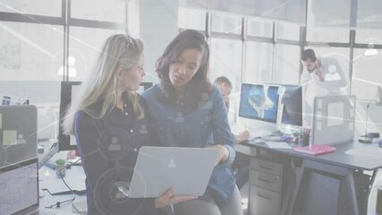 Poster - In busy office, women collaborating using laptop with network connections animation