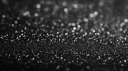 Poster - A monochrome close up of sparkling glitter with bokeh effect in the background and foreground blur
