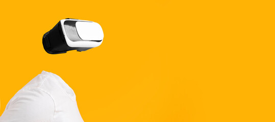 Poster - A user engaged in virtual reality without visible head or face, immersed in augmented reality. The bright yellow background enhances the futuristic feel of this technology-driven experience.