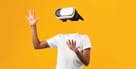 Poster - A person engages with virtual reality using a headset, their body visible but headless, against a vibrant yellow background, showcasing the power of immersive technology and modern devices.