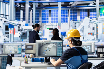 Poster - engineer in solar technology factory reviewing system logs on computer to identify operational ineff