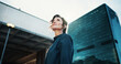 © PeakPoints/peopleimages.com - Morning, inspiration and business woman in city with idea, brainstorming and career insights. Thinking, low angle and confident person for company future, urban development and job opportunity