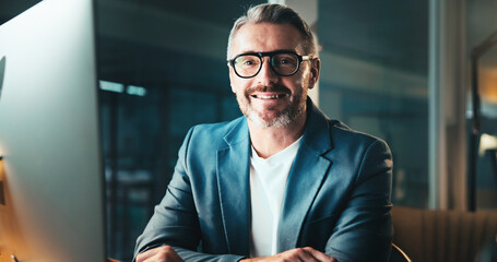 Poster - CEO, portrait and happy business man on computer at night for overtime, finance or investor. Glasses, entrepreneur and confident mature manager in office for private equity at venture capital in USA