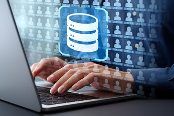 Leinwandbilder - Customer database and information management system CMS. Client data collection and accessing list. Businessman typing on laptop computer keyboard at desk in office.