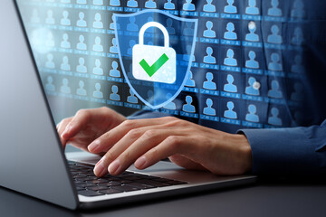 Leinwandbilder - Customer personal information and privacy data protection. Access control and secure encryption system. Businessman typing on laptop computer keyboard at desk in office.