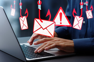 Leinwandbilder - Phishing email scams and personal information theft. Hooked email icon. Warning triangle icon with exclamation mark. Man using laptop computer to open and respond to emails.