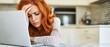 © Peluru - Woman stressed by laptop.