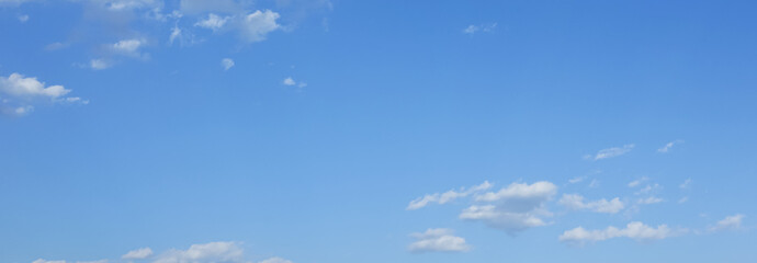 Wall Mural - blue sky and fantastic soft white clouds , horizontal shape with space for design. web banner. wide.