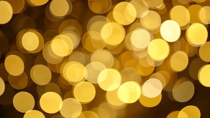 Wall Mural - golden bokeh lights on dark background
