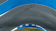 © Kalyakan - Asphalt race track curve with tire mark, Race track for auto racing with car tire skid mark, Car race track asphalt and curve track circuit, Empty curve racetrack car tire mark
