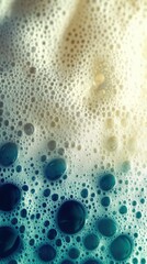 Poster - Bubbles of various sizes rise to the surface, reflecting light and creating a mesmerizing texture in shades of blue and cream, evoking a sense of depth and fluidity