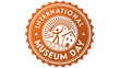 © Ch - Celebrate International Museum Day: A vibrant emblem showcasing a figure joyfully exploring a museum building, a warm, rich orange seal design.