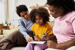 © Bliss - Loving family moments while learning together at home in a cozy living room
