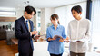 © kazoka303030 - Housing sales: Japanese salesman showing a model room