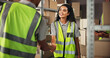 © peopleimages.com - Logistics, colleagues and people in warehouse, handshake and smile for agreement with supplier or stock. Happy, team and shaking hands for collaboration in factory, boxes and partnership for delivery