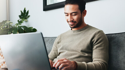 Fototapete - Research, online and laptop with man on sofa for freelancer, networking and email response. Reading, communication and remote worker with person in living room of home for business proposal or typing