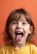 © puruan - Girl making a funny face in orange