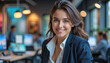 © f_bossa - A portrait headshot photo of a friendly professional CEO executive business worker: A smiling young woman with brown hair, wearing a white shirt and black blazer, confidently looks at the camera