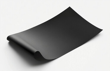 Poster - A slightly curled black sheet of paper is placed on a white surface with soft shadows around it