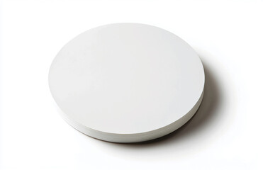 Poster - A simple white circular object casting a soft shadow on a plain white background studio shot view