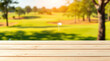 © Rhony - Empty wooden table with blurred golf course background.