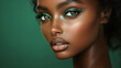 © Oleksandr - Close up of woman with vibrant green eye makeup and smooth skin against a green background