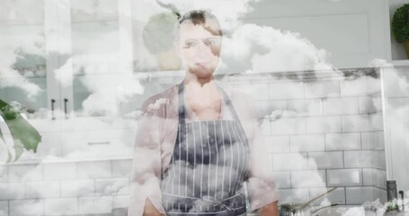 Poster - In kitchen, woman wearing apron with cloud animation effect in background