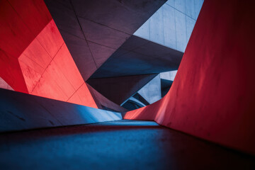 Poster - Futuristic Architectural Abstract with Dynamic Blue and Red Lighting Highlights in Modern Concrete Structure