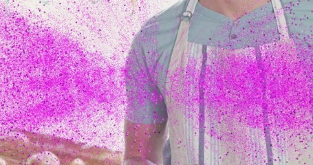 Poster - Wearing apron, man surrounded by colorful animation particles in bright setting